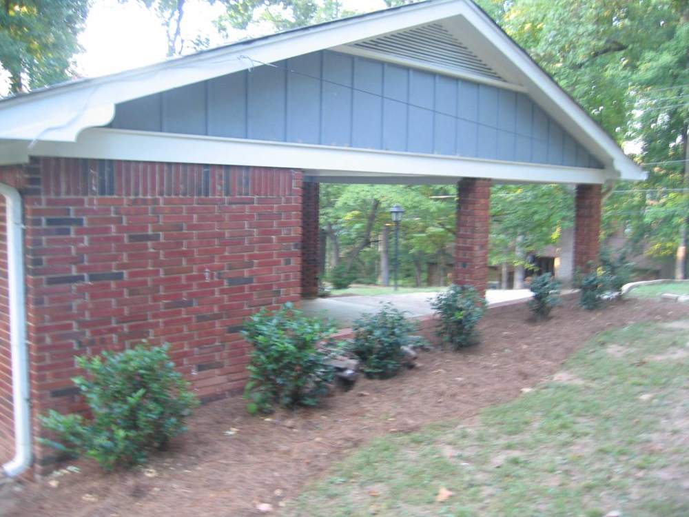 Brick Carport House: Carport side